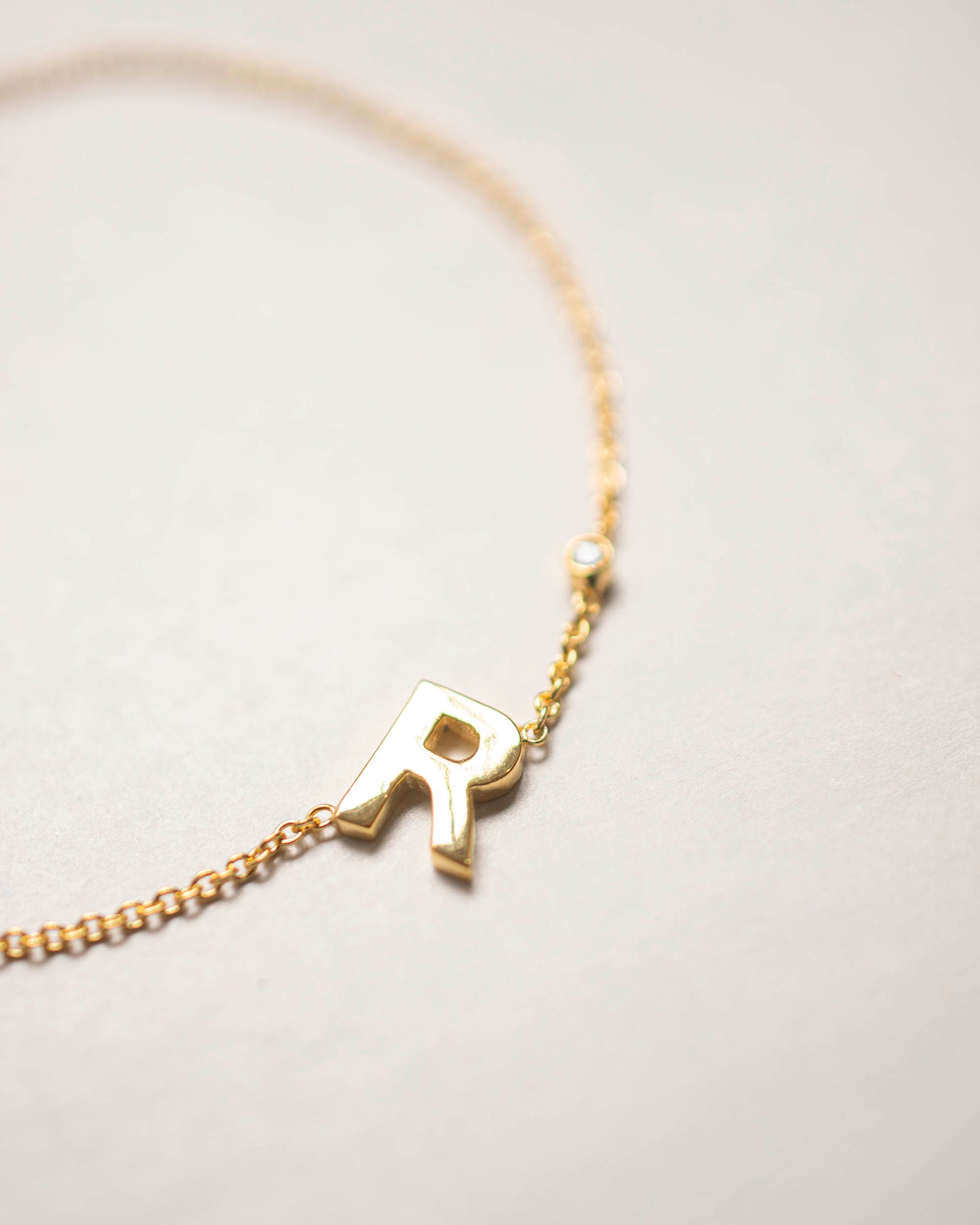 TILTED INITIAL DOT BRACELET